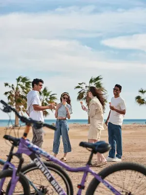 a group of people standing on the beach at Fanadir Hotel El Gouna in Hurghada