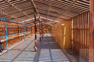 a large barn with wooden stalls in it at Mangrove Bay Resort in Quseir