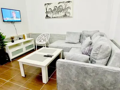 a living room with a couch and a coffee table at Zebra Apartments Hurghada center in Hurghada