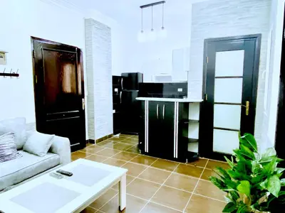 a living room with a couch and a table at Zebra Apartments Hurghada center in Hurghada