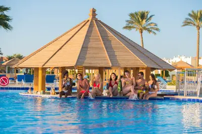 a group of women sitting in the water in a pool at Sunrise Royal Makadi Resort in Hurghada
