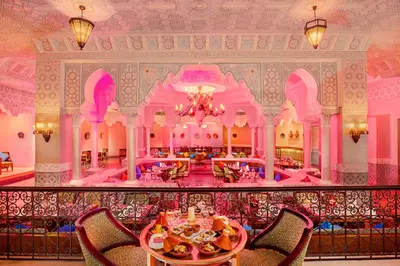 a dining room with a table and chairs in a building at Pickalbatros Palace - Aqua Park Hurghada in Hurghada