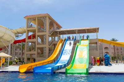 a water park with a slide in the water at Beach Albatros Aqua Park - Hurghada in Hurghada