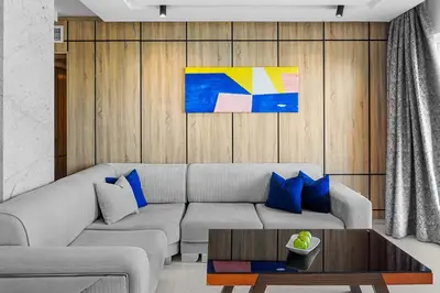 a living room with a couch and a table at Beach Albatros Aqua Park - Hurghada in Hurghada
