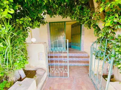 an entrance to a building with a gate and stairs at Tamburine Chalet with Wi Fi Hurghada center in Hurghada