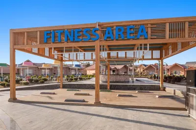 a pavilion with a sign that reads fitnessasyagency at Pickalbatros Jungle Aqua Park - Neverland Hurghada in Hurghada