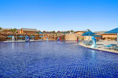 a pool at a resort with a water park at Pickalbatros Jungle Aqua Park - Neverland Hurghada in Hurghada