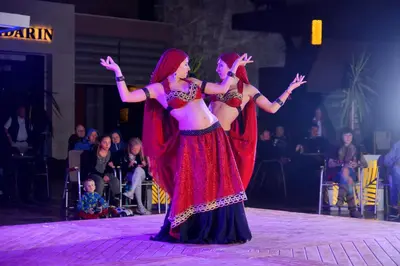 two women performing a dance on the stage at Pickalbatros Aqua Blu Resort - Hurghada in Hurghada