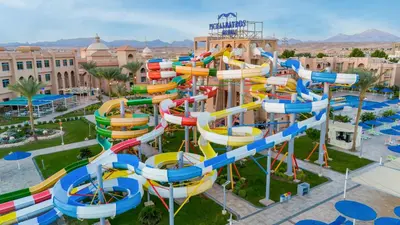 a water park with a colorful water slide at Pickalbatros Aqua Park Resort - Hurghada in Hurghada
