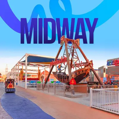 a playground with a large sign that reads midway at Pickalbatros Alf Leila Wa Leila Resort - Neverland Hurghada in Hurghada