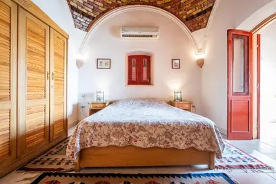 a bedroom with a bed in a room at villa al diwan luxor in Luxor