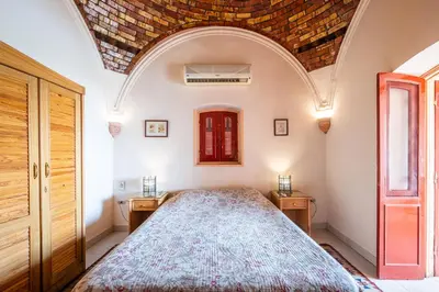 a bedroom with a large bed in a room at villa al diwan luxor in Luxor