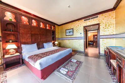 a bedroom with a large bed in a room at Sunrise Mamlouk Palace Resort in Hurghada