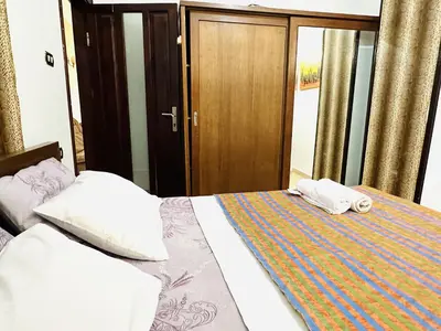 a bedroom with a bed with two towels on it at Diamond Arabia with Wi Fi in Hurghada