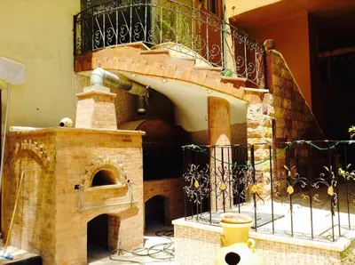a brick pizza oven sitting next to a balcony at Diamond Arabia with Wi Fi in Hurghada