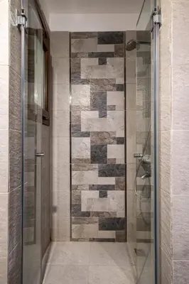 a shower with a glass door in a bathroom at El Gouna 1 Bedroom Apartment west golf ground floor in Hurghada