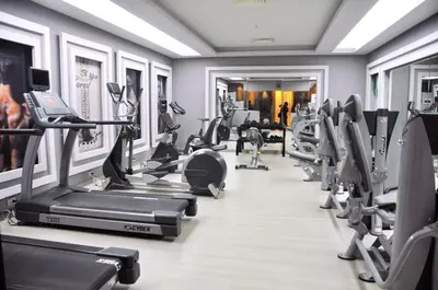 a gym with treadmills and elliptical machines at Sunrise Holidays Resort -Adults Only in Hurghada