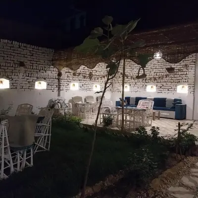 a room with chairs and a couch and a table at House of Dreams apartments Luxor in Luxor
