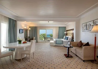 a large hotel room with a living room at Premier Le Reve Hotel & Spa Sahl Hasheesh - Adults Only 16 Years Plus in Hurghada