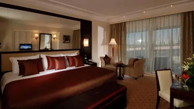 a bedroom with a large bed in a hotel room at Premier Le Reve Hotel & Spa Sahl Hasheesh - Adults Only 16 Years Plus in Hurghada