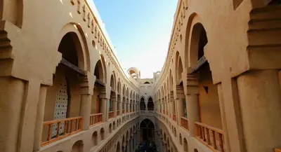 an empty hallway of a building with arches at Embrace Hotel in Luxor