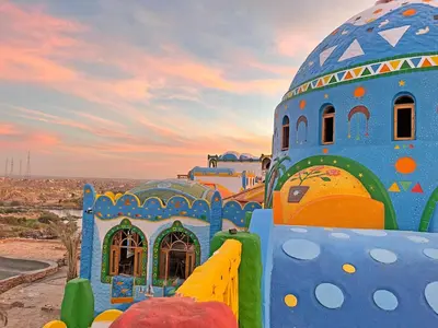 a playground with a blue building with a dome at Kato Dool Wellness Resort in Aswan