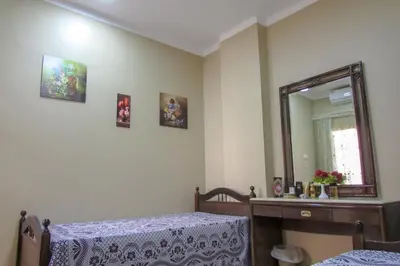 a bedroom with a bed and a mirror at Apartments Desert rose near the sea RedSeaLine in Hurghada