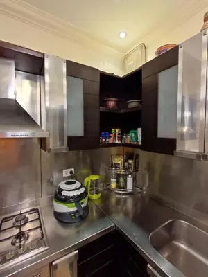 a kitchen with a stainless steel counter top and a sink at Villa Rayan in Hurghada