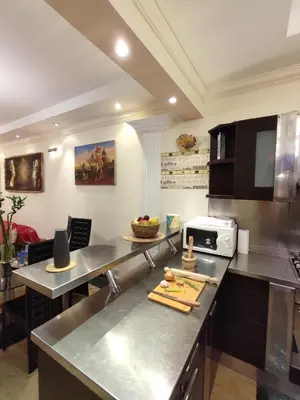 a kitchen with stainless steel counter tops and appliances at Villa Rayan in Hurghada