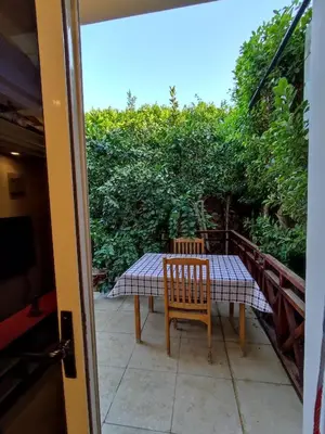 a table and chairs on the balcony of a house at Villa Rayan in Hurghada