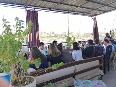a group of people sitting on a bus at El-amin Guest House in Aswan