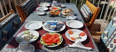 a long table with plates of food on it at Thebes Hotel in Luxor