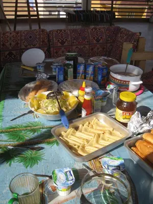 a table with some food on it with a table cloth at Bet El Kerem Guesthouse in Aswan