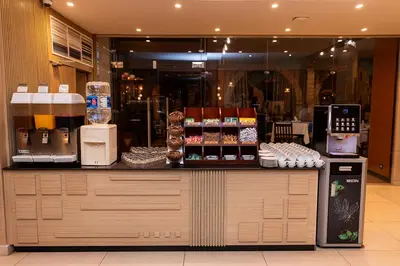 a counter in a store with a coffee shop at Basma Hotel Aswan in Aswan