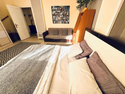 a living room with a bed and a couch at Safari Home with Wi Fi Hurghada center in Hurghada