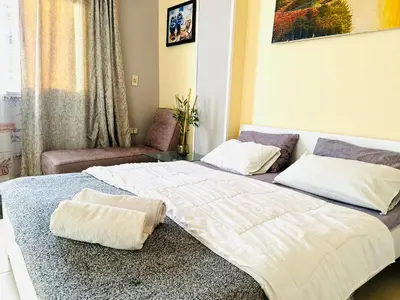 a bedroom with a large bed with a pillow on it at Safari Home with Wi Fi Hurghada center in Hurghada