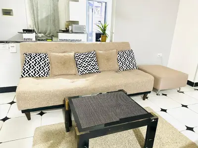 a living room with a couch and a table at Lima Modern Sheraton with Wi Fi in Hurghada