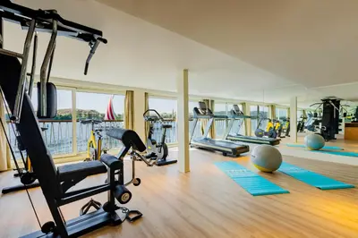 a gym with several treadmills and exercise bikes at Tamr Nile Cruise - 04 Nights Every Monday from Luxor - 03 Nights Every Friday from Aswan in Luxor