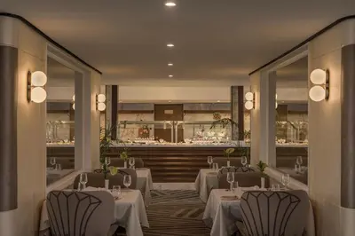 a restaurant with tables and chairs in a room at Tamr Nile Cruise - 04 Nights Every Monday from Luxor - 03 Nights Every Friday from Aswan in Luxor