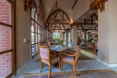 a dining room with a table and chairs at Makadi Palace - Couples and Families Only in Hurghada
