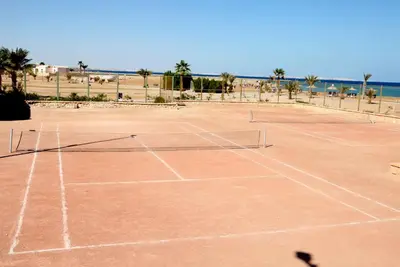 a tennis court in front of the beach at Hurghada Coral Beach Hotel in Hurghada