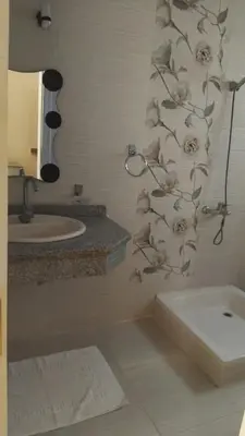 a bathroom with a sink and a bath tub at Sunny Luxor in Luxor