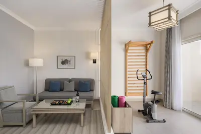 a living room with a couch and a table at Iberotel Casa Del Mar Resort in Hurghada