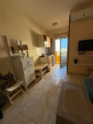 a living room with a kitchen with a view of the ocean at Budget studio near El Gouna and Kite station in Hurghada