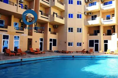a swimming pool in front of a building at Budget studio near El Gouna and Kite station in Hurghada