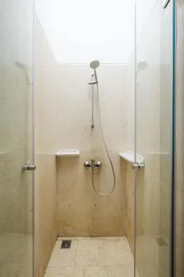 a bathroom with a shower with a glass door at El Gouna 2 bedrooms apartment South Marina Ground Floor in Hurghada