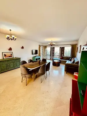 a large living room with a table and chairs at Aprtment at Abu Tig Marina - MP6 in Hurghada