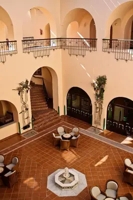 an empty lobby with chairs and a staircase at Arabella Azur Resort in Hurghada