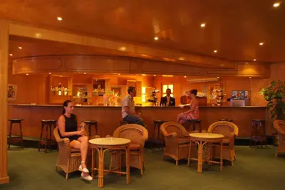 a group of people sitting at a bar at Bel Air Azur Resort (Adults Only) in Hurghada