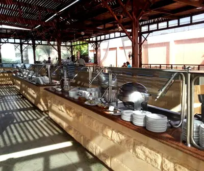 a buffet line with dishes and utensils at Giftun Azur Resort in Hurghada
